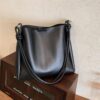 Side view of umber black women shoulder bag