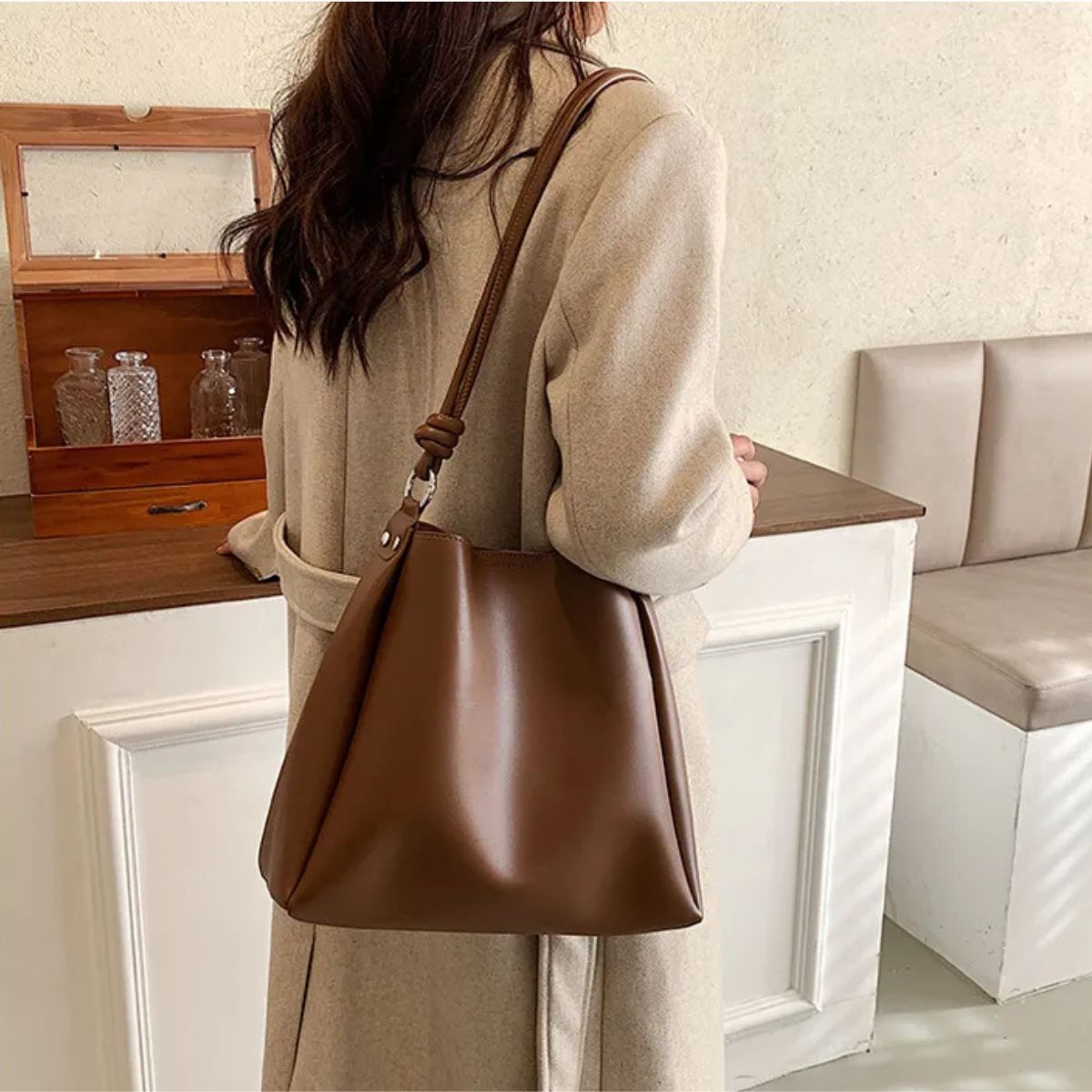 Woman carrying umber brown shoulder bag for daily use